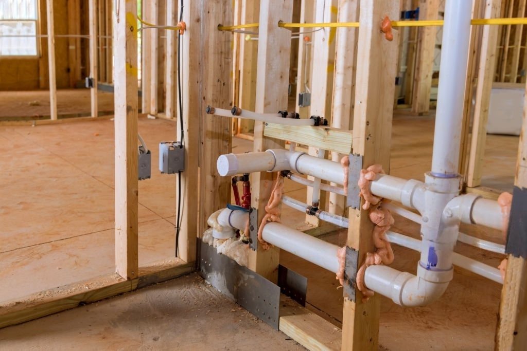 PVC plumbing pipes installed inside a new construction home in Franktown.