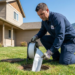 Technician feeding a CIPP liner into a residential cleanout during the trenchless sewer repair process