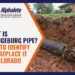 Alphalete Trenchless Services graphic titled What Is Orangeburg Pipe? How to Identify and Replace It in Colorado, showing a flattened black Orangeburg sewer pipe with roots at a separated joint in a backyard dig